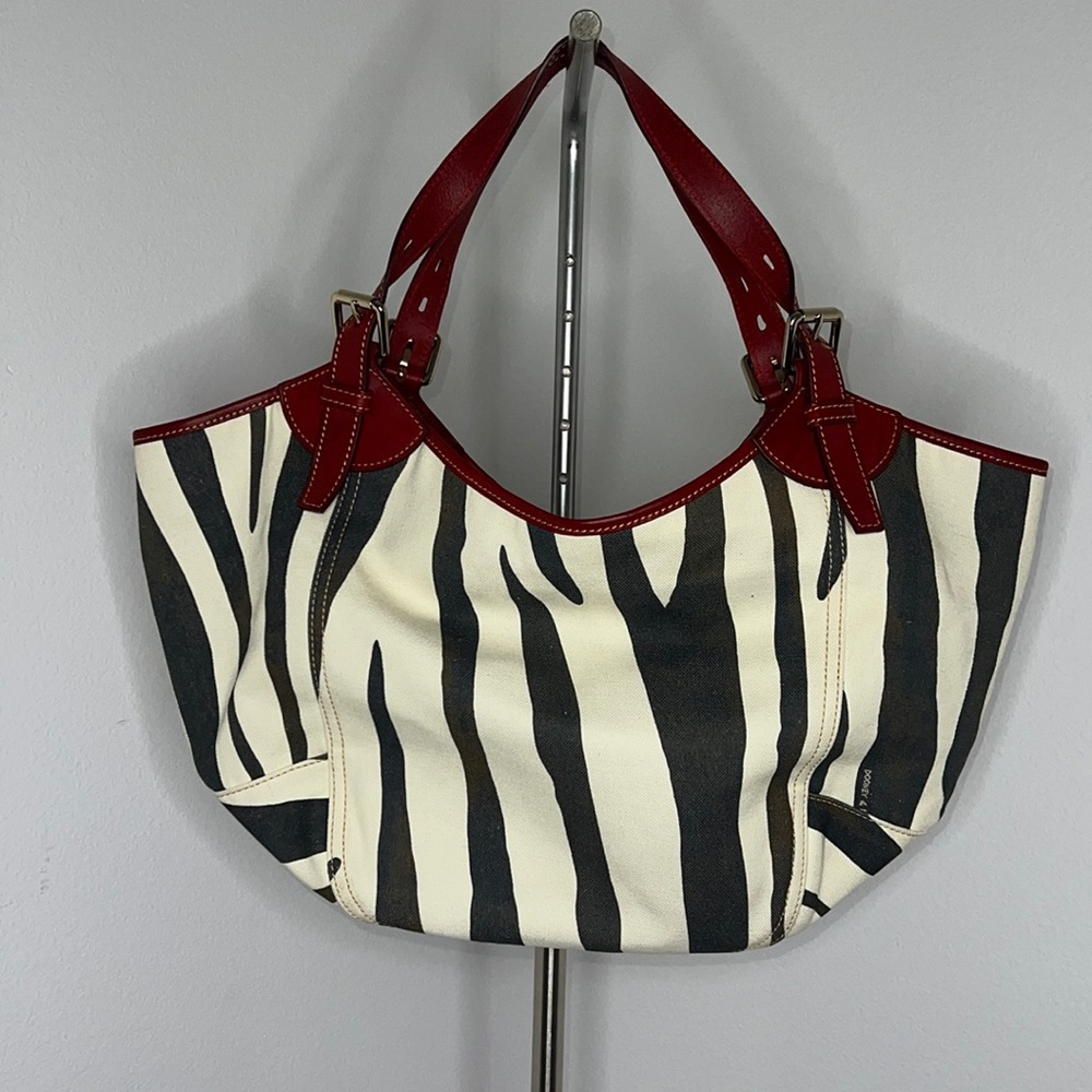 Dooney & Bourke Zebra Print Tote with Red Accents
In pristine condition. - Picture 2 of 8